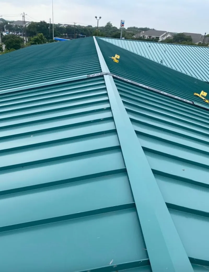 Green commercial metal roof ridge and valley for Metal Roof Repair in Detroit Lakes